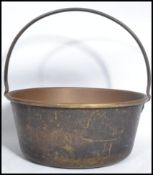 A late 19th century Victorian copper and brass cast handle jam / preserve pan. The handle fitted