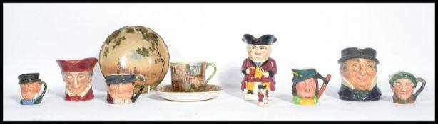 A collection of Royal Doulton to include Toby jugs, Dickens ware, Gleamers etc please refer to