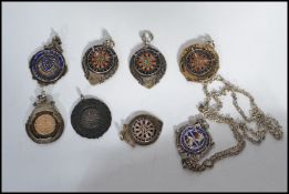 A group of eight silver hallmarked fob medals one being on an albert chain. Fobs to include