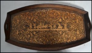 An early 20th century Sorrento ware burl wood tray having marquetry inlaid decoration depicting a