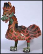 A 20th century Indian wooden sculpted and carved depiction of a chicken being hand painted with