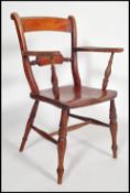 A 19th Victorian oxford bar back Windsor dining chair raised on turned legs with panel seat having