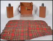 A unusual 20th century drinks flask picnic set held within a vintage pig skin bag. Consisting of two