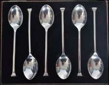 A boxed set of six silver hallmarked seal top spoons within the original fitted case with silk and