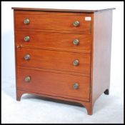A 19th century  / early 20th century mahogany inlaid cupboard / cabinet being stylised as a chest of