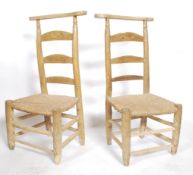 A pair of French country pine prie-dieu chair having straw weaved seat and spindle stretchers raised