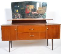 A retro mid century Danish influence teak wood dressing table being raised on squared legs with a