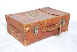 A vintage 20th century leather gentleman's suitcase having leather straps and buckles.