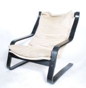 A retro 1970's vintage Scandinavian bentwood easy chair having an ebonized frame with material