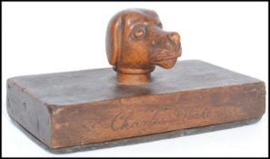 An unusual 19th century Victorian paperweight carved wooden in its construction with inscription