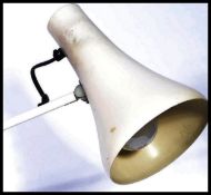 A 20th century retro Herbert Terry Anglepoise desk lamp having a circular base with conical shade in