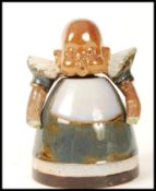 A Doulton salt glazed stone wear inkwell and cover modelled as a baby. Impressed marks to base 6985.