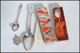 A collection of silver hallmarked items to include a Victorian dessert spoon London 1848 by Samuel
