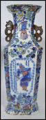 A 19th century Chinese vase having blue and white decoration of birds with dragon handles to