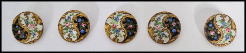 A set of five 19th century enamel and hand painted buttons, each button decorated with hand