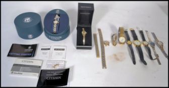 A collection of ladies and gents rings to include a Citizen eco - drive boxed ladies watch in