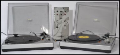 A pair of Gemini XL - 200 mixing record belt drive turntable decks together with a Gemini PMX 60