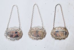 A.  collection of 4 silver hallmarked Decanter labels to include Gin, Brandy, Sherry and Whisky, all