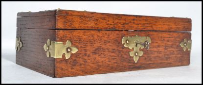 A vintage early 20th century oak cigar box having brass mounts and lettering to top reading