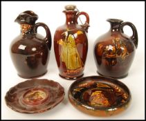 A good collection of Royal Doulton kingsware liqueur flasks to include the pied piper liquer flask