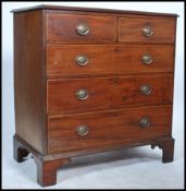 A 19th century Georgian Regency mahogany inlaid bachelors chest of drawers being raised on bracket