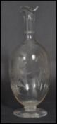 A 19th century Victorian hand blown cut glass decanter raised on a circular foot with hand