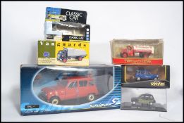 A group of boxed diecast models of various scales to include a Solido large scale Renault 4 a