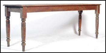 A good Victorian library table of long form being raised on turned legs with fitted frieze frame.