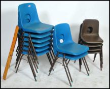 A set of  6 retro 1970's blue plastic and tubular metal stacking chairs. Raised on ebonised