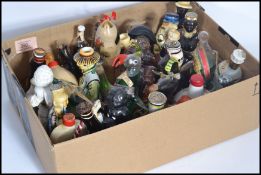 A group of vintage 20th century drinks miniatures to include Beswick bull , seal etc. studio art