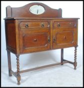 A 1920's oak barleytwist / barley twist mirror back sideboard dresser base. Raised on barley twist