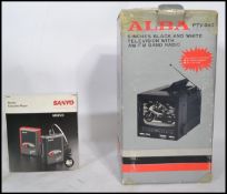 A retro boxed possibly unused new old stock Alba portable television and radio combi together with a
