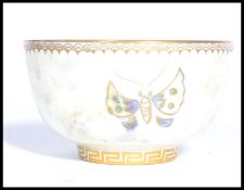 A vintage 20th century Wedgwood butterfly lustre bowl, with orange interior and opalene exterior,