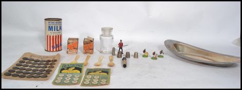 A collection of vintage curios to include 19th century bone spoons, thimbles, needle case in the