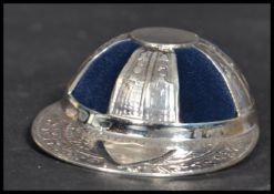 A sterling silver pin cushion in the form of a vintage school hat. Weighs 19 grams.