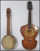 A vintage 20th century Broadway Banjolele musical instrument along with a 19th century believed