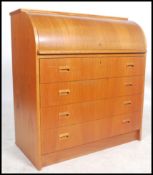 A retro / vintage Danish influence teak wood cylinder bureau, having a fully appointed interior over