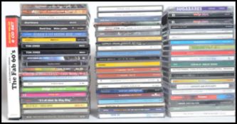 A collection of Compact Discs featuring various artists to include Blur, The Charlatans, David Gray,