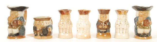 A group of six Doulton Lambeth miniature Toby jugs with impressed marks to base. Note; from an