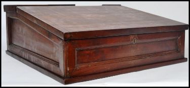 A vintage early 20th century desktop Clerks desk having a hinged lid and appointed interior. 21.