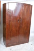 A 1940's utility bedroom furniture set comprising gentlemans double wardrobe together with a