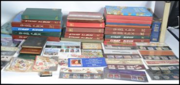 A large collection of vintage World stamps dating from the 19th century to include many GB stamps.