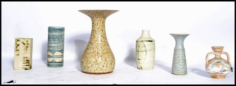 A group of vintage 20th century studio pottery to include a cylindrical vase signed to the base