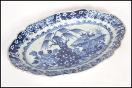 A 19th century Chinese blue and white hand painted porcelain plate / platter tray having