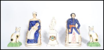 A group of ceramics dating from the 19th century to include a pair of Staffordshire flat back fire