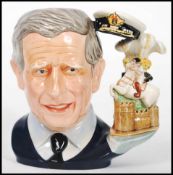 A Royal Doulton character jug depicting The Prince of Wales, Prince Charles D7283 , handle