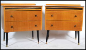 A matching pair of vintage 20th century small chest of drawers raised on tapering ebonised legs. The