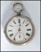 An early 20th century silver cased pocket watch part lever. The white enamel face with Roman numeral