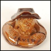 A Doulton Lambeth Salt-Glazed ``Saved`` Figural Match Holder, circa 1894, modelled as a drowning man