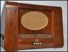 A vintage 20th century HMV His Masters Voice mahogany cased radio with oval grille dials and buttons